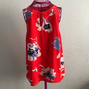 Red blouse with floral designs
